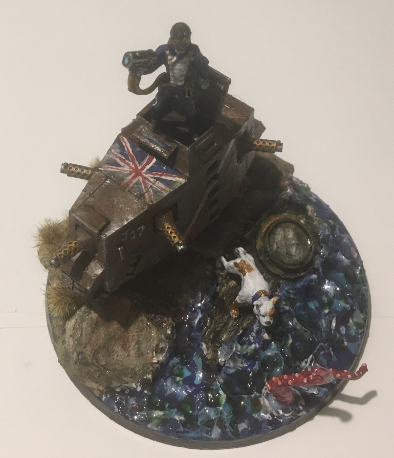 When creating renditions of the OTT/BoW crew I did say all were present and correct! But I was wrong and I apologise because I’d forgotten the tank master himself @johnlyons. Now I couldn’t really stick a Leman Russ alongside these steampunk styled British Colonial soldiers but out of my pile of shame emerged a solution in the form of a crazy armoured tank bike from Zinge Industries. What’s more I discovered that the 17th Cavalry Lancers (famous for the Charge of the Light Brigade in the Crimean War) also provided mounted support in the Zulu war and so in this case, Lieutenant Lyons could ride into battle in the blue and white fatigues of that famous unit, not on a horse but on a steampunk tank!