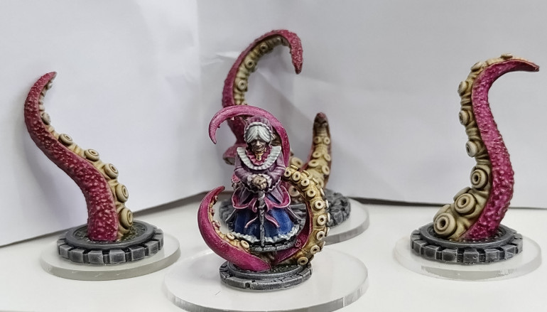 And the leader of famiglia, La Donna: Sybilla Vendetta. In the background are her favourite tentacled friends from another dimension, that she summons if people don't show proper respect to the elderly.
