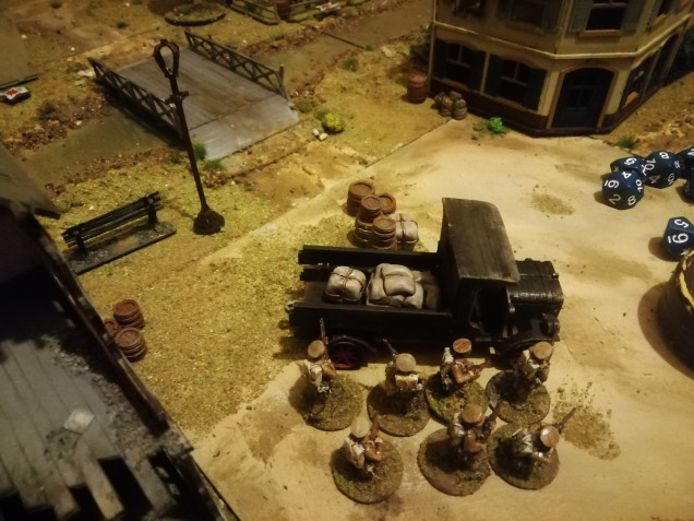 Our second squad broke out into the town square using abandoned vehicles for cover 