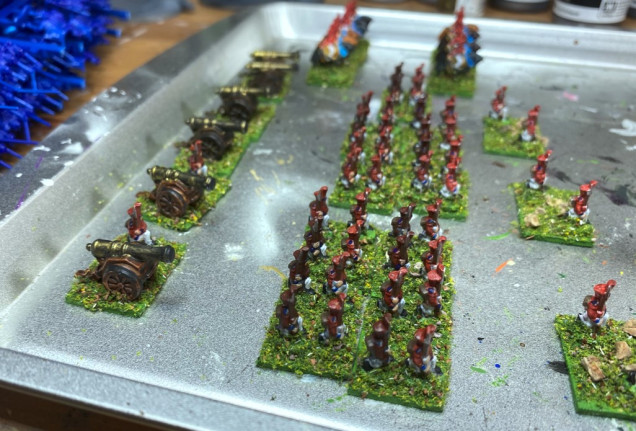 The bases were painted green and flocked to finish the effect.