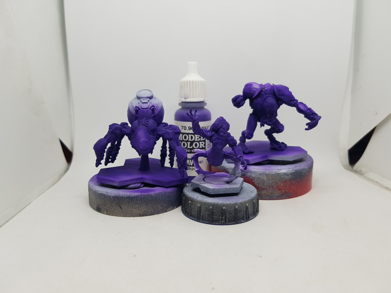 Purple flesh tones base coated with VMC 70.960 Violet.  Later to be washed with Nuln Oil