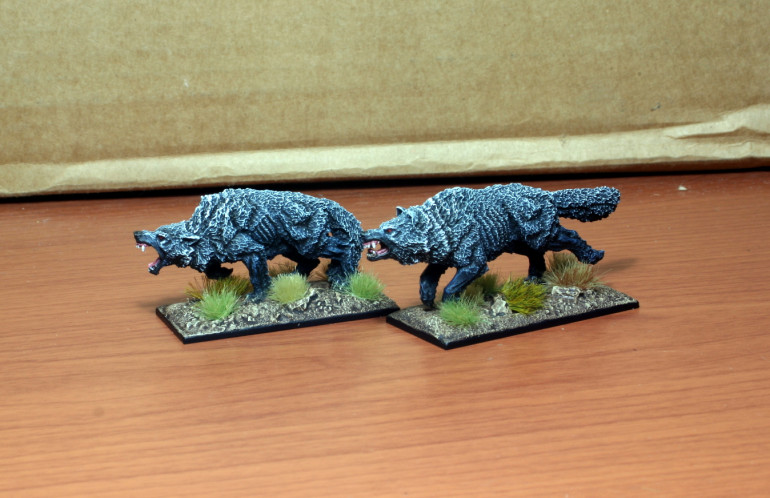 Resin direwolves from Gamezone Miniatures.  They have other poses as well.