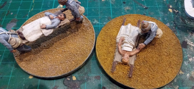 The base on the left was dry brushed with Vallejo Deck Tan