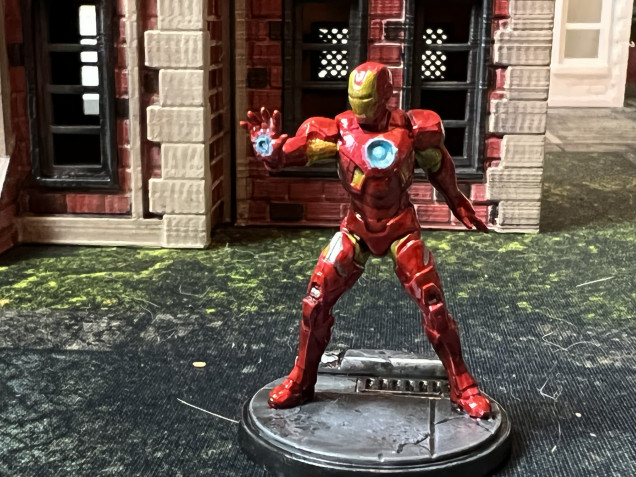  Iron man was a simple build and paint. I went for a silver dry-brush over my traditional zenithal highlight and used contrast paints for the armor. Reactor and hand beams were achieved with blue and white paint.