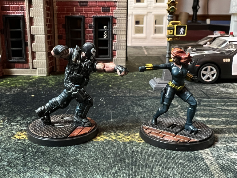 I already showed Crossbones fighting three Black Widow in an earlier post and he is by far one of the easiest miniatures of the set to assemble and paint. I used two different kinds of washes (blue and black on his pants and vest so as to create a slight variety in black shades.