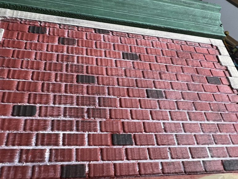 I then added a little black to the brick color and picked a few bricks on each wall to add variety. I also dry brushed some wall area lightly with black. 