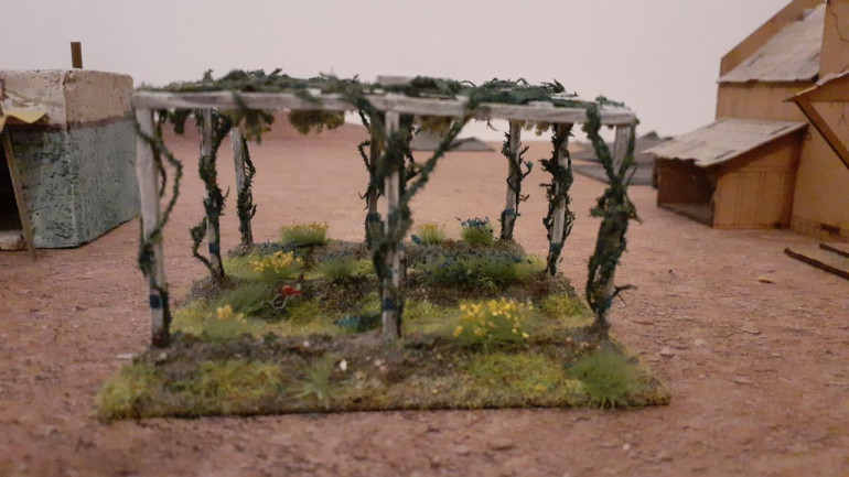 I used the same basing technique as for the beehives, except  that I coveted the raised beds in Lukes Gaming Scenics Scrublands avoiding the larger stones and foliage. 