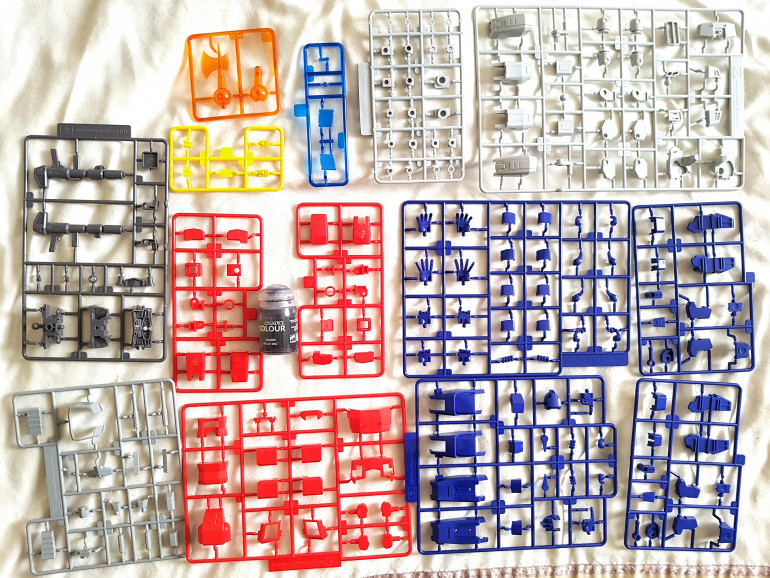 All the sprues from in the box.  The paint pot is for a sense of scale.