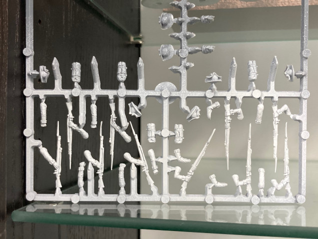 Prime the whole sprue the same primer as the body.