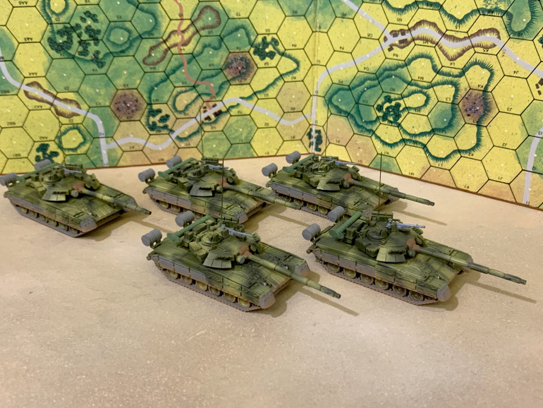 T-80s at their current stage. Next is sharpen-up adjustments on the camo scheme, dark wash (to tone down these bright, high-contrast colors), some LIGHT highlights, and finally smaller details.