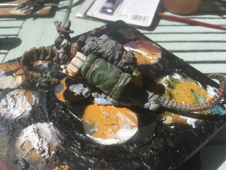 First up to the painting turntable in the Grenadier Dragon Lords Iron Dragon. There is deterioration to the tail, so the nearest match is GW Tin Bitz followed by a wash of Reikland Fleshshade. The baggage was refreshed with Thaka Green, Casandora Yellow, Carroburg Crimson, and Drakenhof Nightshade. The rocky base was refreshed with Declan Mud Wash.