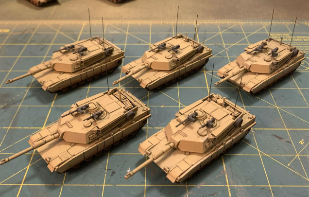 Progress on my Abrams - filter washes to align the hue with rpre-existing Gulf War models, then pin washing on all these %&#(*$# straight panel lines on the Abrams to bring out the details.  Also, a little progress on radio antennae and secondary weapons.