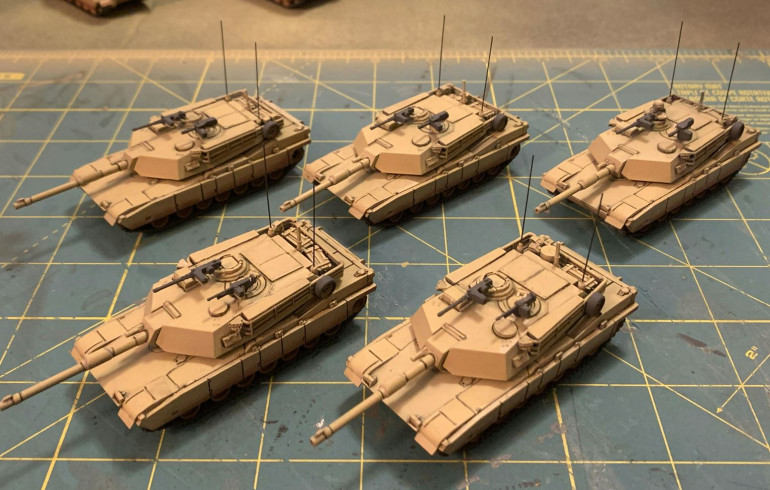 Progress on my Abrams - filter washes to align the hue with rpre-existing Gulf War models, then pin washing on all these %&#(*$# straight panel lines on the Abrams to bring out the details. Also, a little progress on radio antennae and secondary weapons.