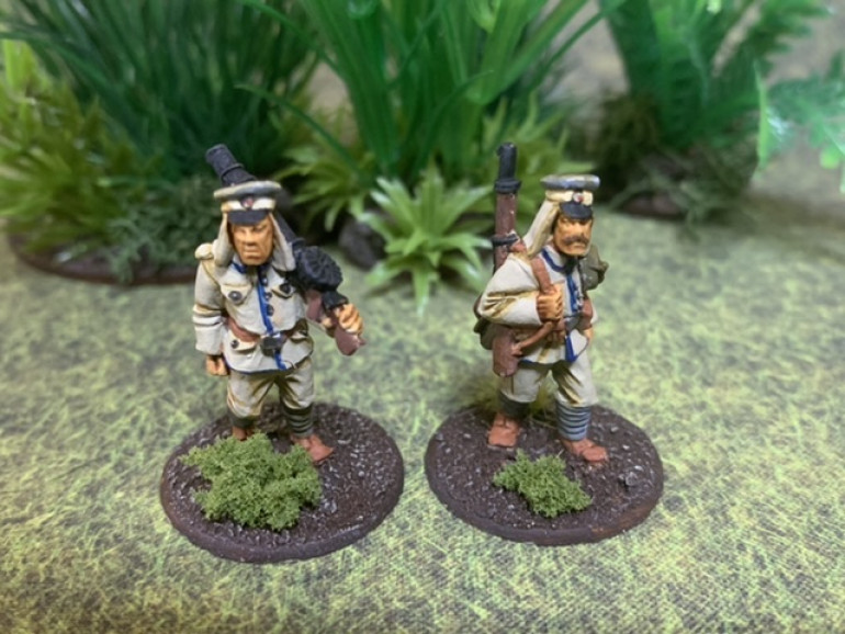 Asiankorps figures from Brigade Games sporting captured Lewis guns. Painted up as East African Schutztruppe. The uniforms are similar and the field caps virtually identical but in different colors. 