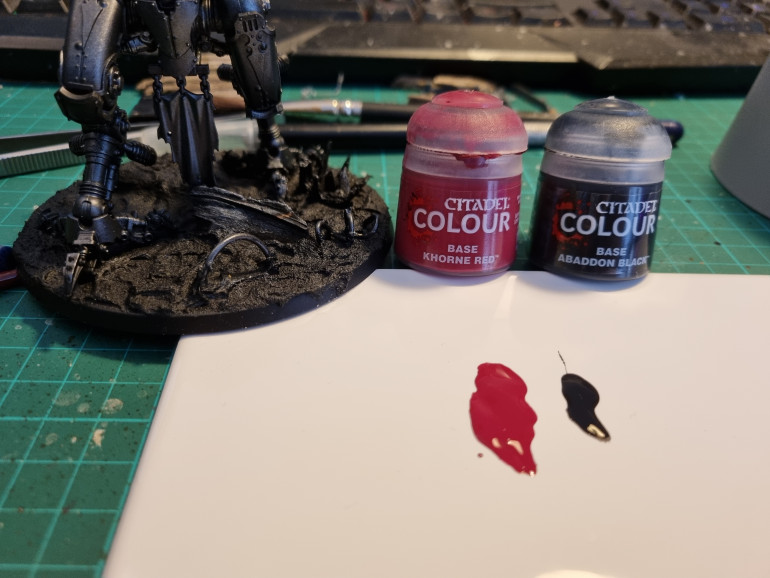 Started with a mix of Khorne Red and Abbadon Black, roughly 3 to 1 ratio and using a mini stipling/dry brush painted/polished (small circular motions) the mix onto the relevent armour panels