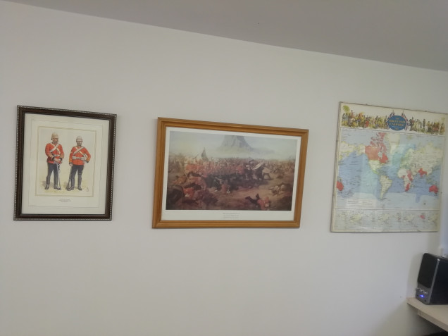 All the pictures I'm not allowed to put up in the house have moved into the den. For some reason my wife doesn't want a map of the empire on the wall. How else can I plan where my little men are going to go off fighting. Most of my pics are Zulu war related