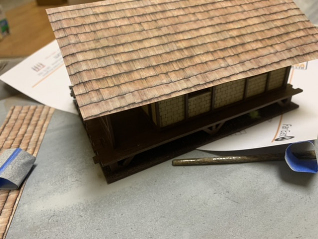 I didn’t particularly like the roof as painted. But while taking a look at the Sarissa website I found downloadable roof PDFs to print out. I made them oversized and them glued them down with PVA glue. 