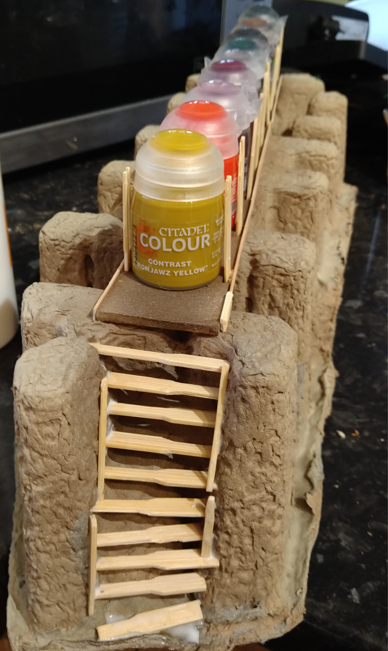 I used coffee stirrers and the rest of the cocktail forks to fashion stairs at both ends of the bridge.