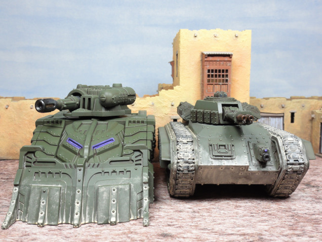 Left: Brandr Urban Assault variant from Mantic's Sturnhammer Battle Tank kit.  Right: A 1995 GW Hellhound being used as a Brandr Urban Assault Vehicle