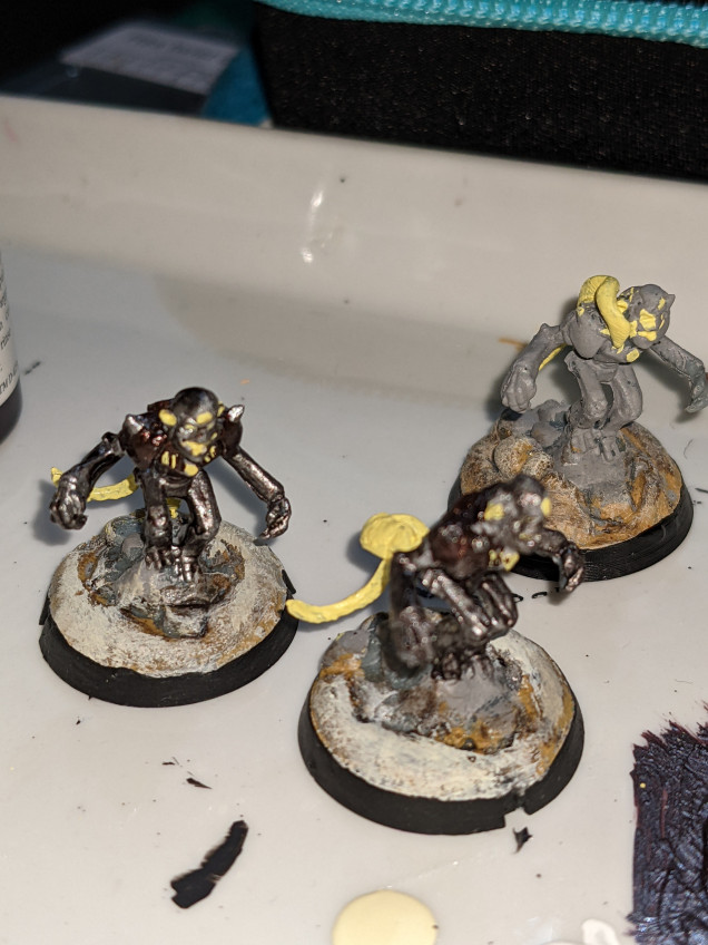 Worked the evening, so just a little tonight. Black the last base ring, some gun metal on the monkey, and some dark tone wash. Three down, six to go.