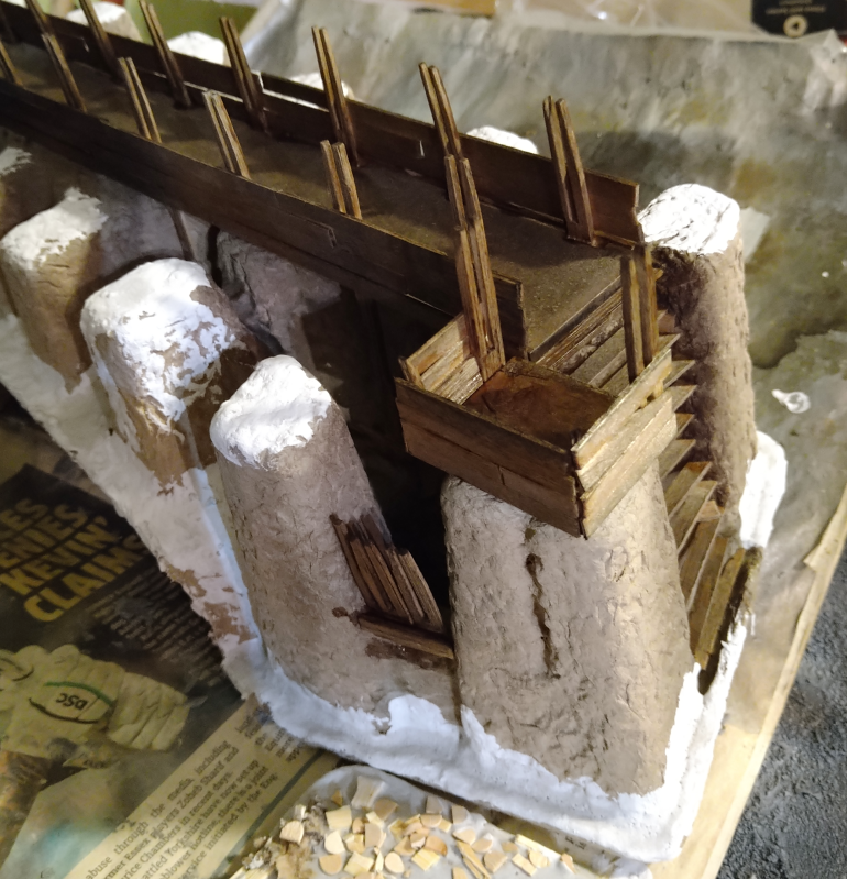 I didn't really add enough black paint to make it more grey, so I will likely need to use some Halfords Grey Primer to unify the stone and then drybrush to bring out the texture again.