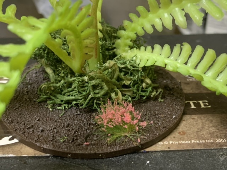 I used PVA glue to add some lichen to conceal the attachment points and an occasional flower tuft to add some color. 