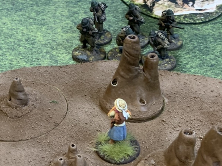 Central objective is in control of the French as the Askari squad has been forced back out to the far side of the termite mound and reduced to a single Askari. 