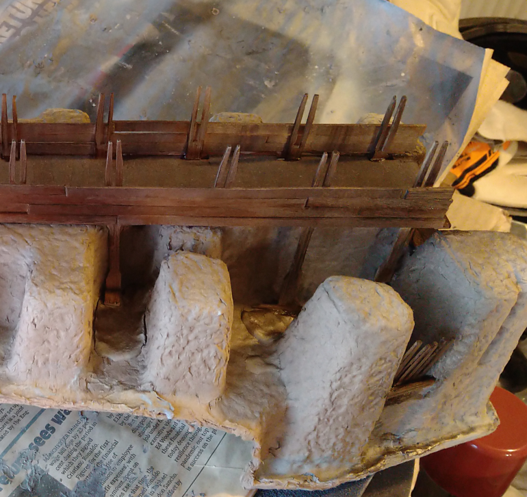 Ideas have started to flow again. Wondering whether I need a winch and ropes to get bigger items up the stairs to the crossing level. Or whether there should be the remnants of an old gate that used to close off the ladder and make ascending the stairs a death sentence if the people on the bridge wanted to protect the crossing.