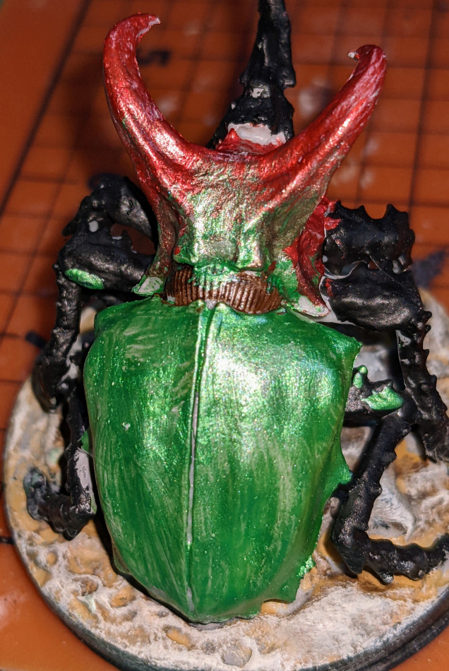 Tired, worked on the Porigata a bit. Tried to blend red and green metallic to try to do something neat. We'll see in the morning, and clean up some black spots. pretty close.