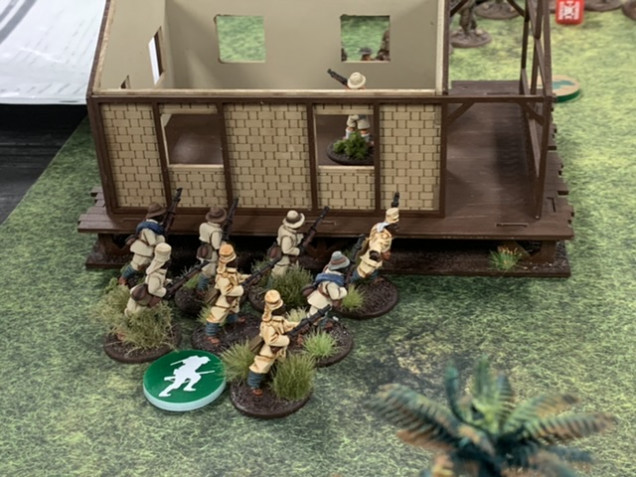 The Askari move rapidly toward the building keeping it between themselves and the Americans trusting that the other squads will keep up the fire on the approaching Americans.