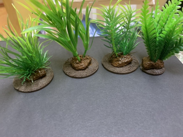 The bright stone bases on these plastic plants got painted over in Burnt Umber as well. 