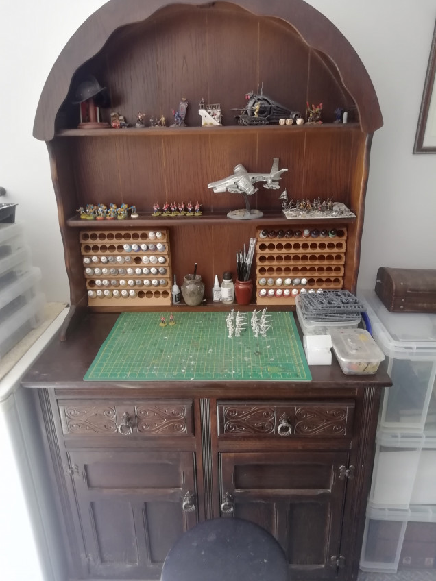 I have placed some terrain tiles into the dresser and used it as a paint Station so I can put minus I work on up on the shelfs. I need a better seat. 