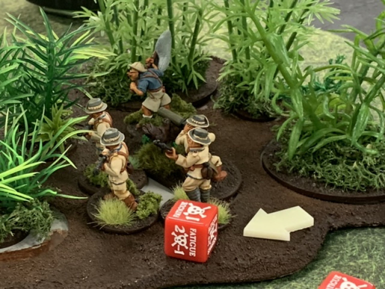 Not pictured but earlier, an American squad charged the Askari squad and forced it out of the jungle. The Schutztruppe squad advanced and shot the American squad off the board. It then weathered several rounds of shooting taking casualties but little fatigue. 