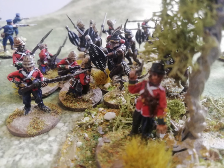 Impetuous unmarried zulus crash into the British line and the major seeks cover as a second Zulu unit hits the line while its preoccupied with the first.  Without being able to deliver any closing fire the British position falters 