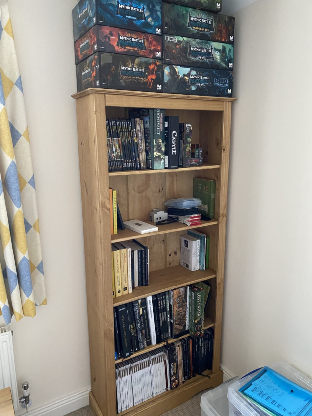 My new rule is that if a book doesn't fit on this shelf then another will have to be given away, sold or recycled to make space for it. Also on top of the bookshelf you can see my Mythic Battles: Pantheon collection.