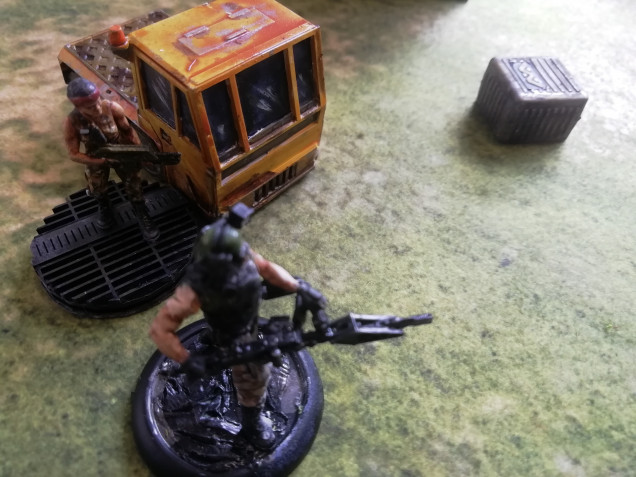 The colonial marines close in on the opposite side laying down fire from a gunner 