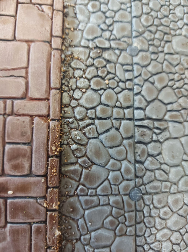 I used some small rock scatter to add some character to the streets, and make them look a little more worn. 