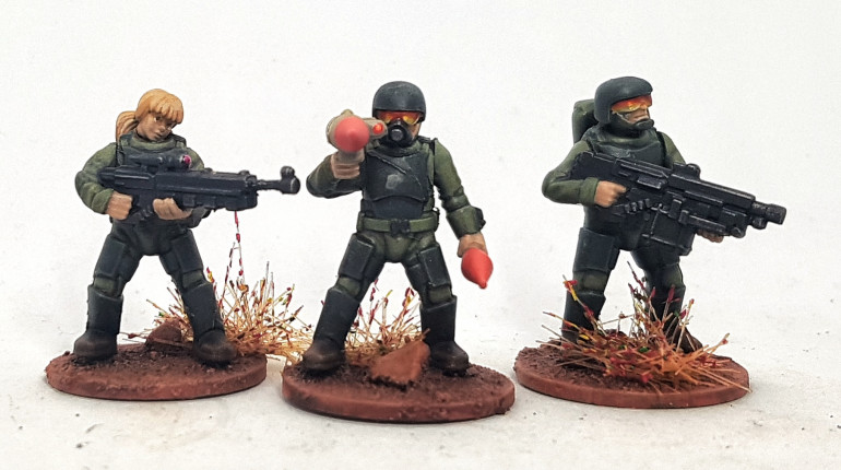 Stargrave Troopers: Sniper, Grenadier, and Gunner.  The sniper gun was extended by cutting off its end, turning it upside down and reattaching it on the end of a length of paperclip, made fatter by glue residue from cleaning glue nozzles.  I should have gone a little longer, I think.