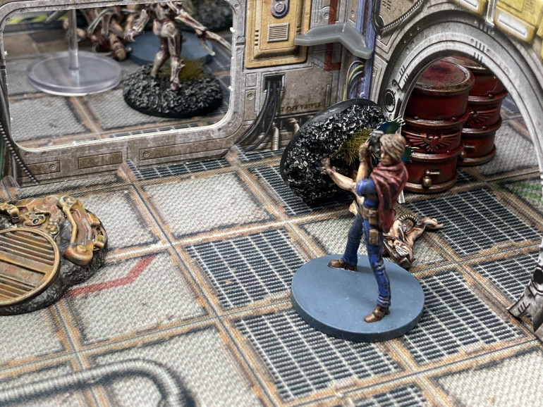 Arianna dashes out of cover and past one of the turrets to aid the commander in fighting the mutants.