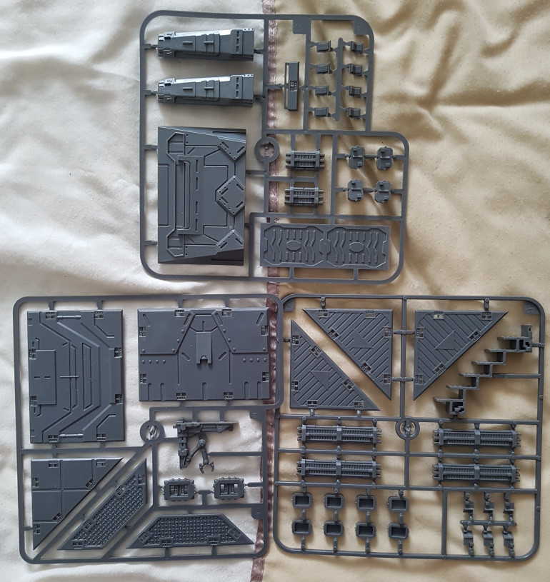 Mantic Battlezones sprues.  Are they from a particular kit?  I've a bunch of this stuff built, and some leftover parts.  I wonder if I can assemble anything using this?  One more small building/ruin I imagine, at best.  Came in the Chillcon goody bag.  Update these are Urban Sprue D & E & ??