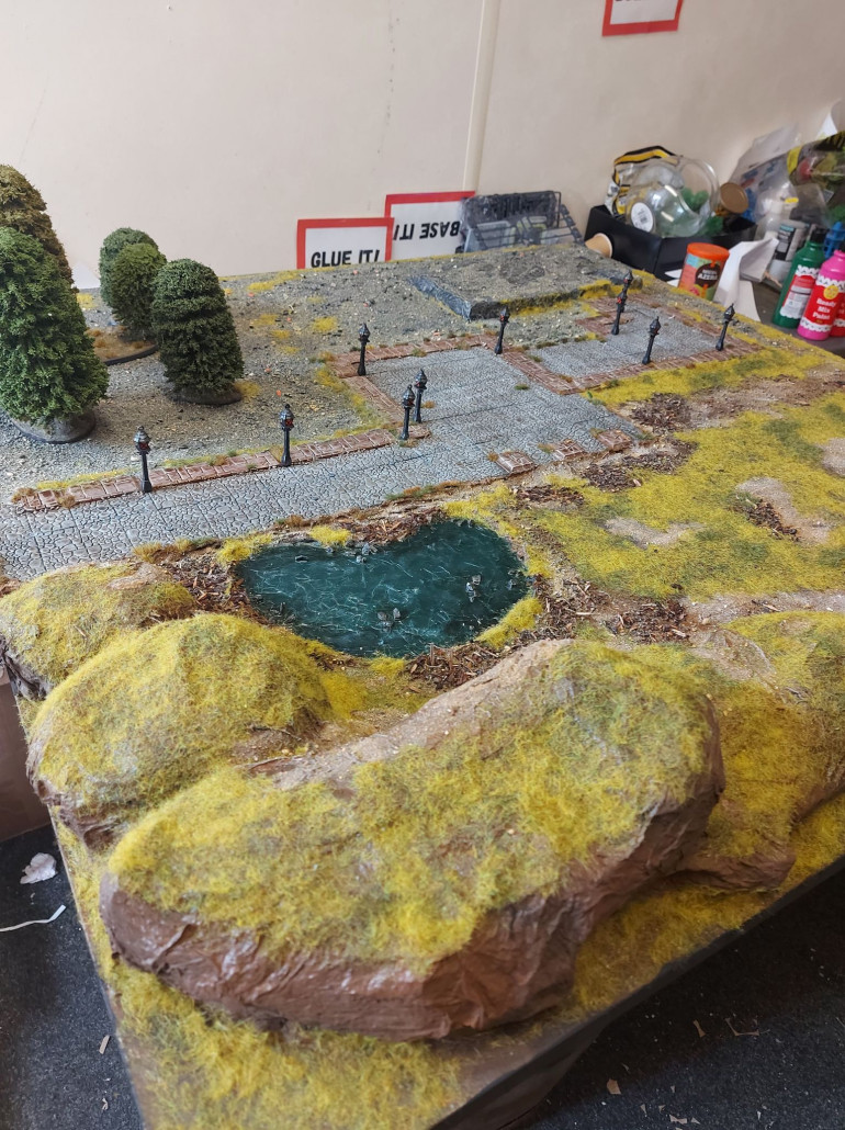 With the first of our Moonstone Monthly events happening this Saturday, I have finally finished the board! The houses are all painted ready. The trees are based. Ducks have been 3d printed for the pond. It's been a lot of fun to work on, and I think I'll do one for Kings of War next. Or maybe I'll paint a Deadzone faction. Decisions decisions. . . 
