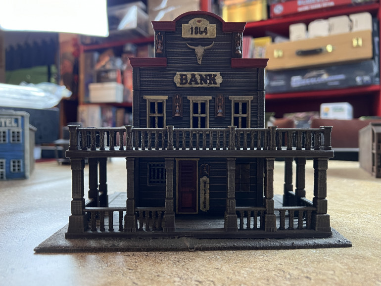 Next, I picked a few Printable Scenery models. I have long loved the quality of their files and you can find them at https://www.printablescenery.com/ . One of my oldest #d printed models was this bank, a fruit of my early drive to create Dude City.