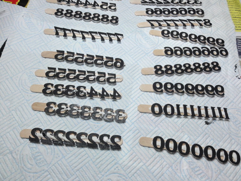 Numbers were poster tacked to sticks for ease of painting