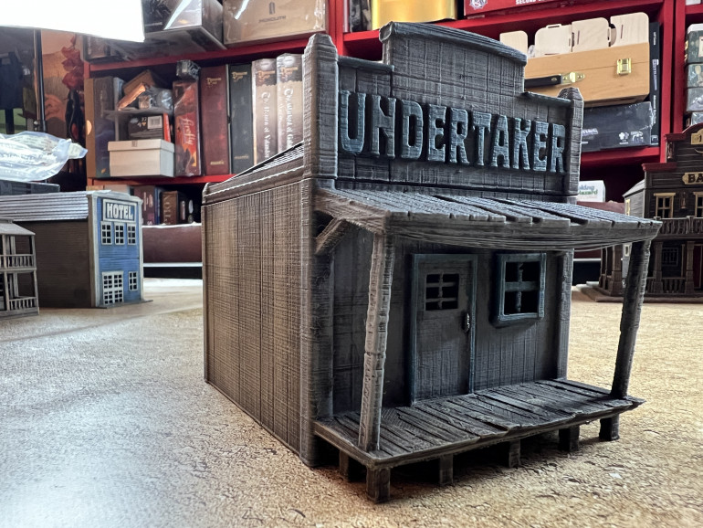 Every wild west town needs and undertaker and this one is very small and easy to paint. I went with a sober grey and light blue scheme.
