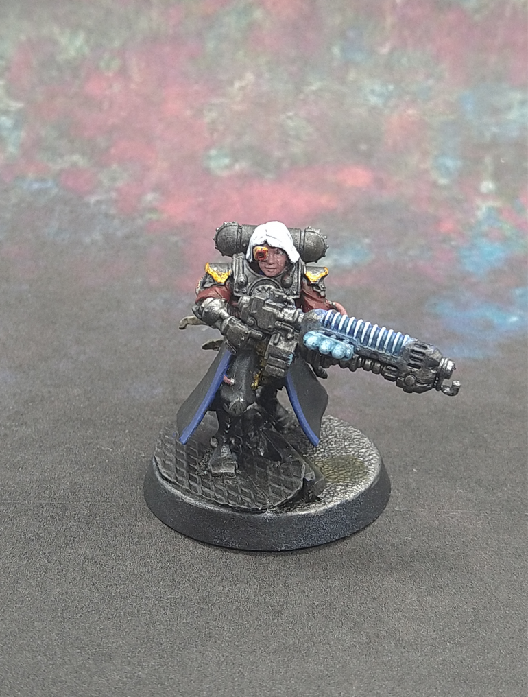 Rather than use a Mechanicus backpack I snipped off the already painted pack from Lennoxi and used that as Lonnoxi was being bulked up to her Primarus backpack. I think the pack gels her with the unit quite well. The head is from the Stargrave Crew II sprue same as Rosalindi.