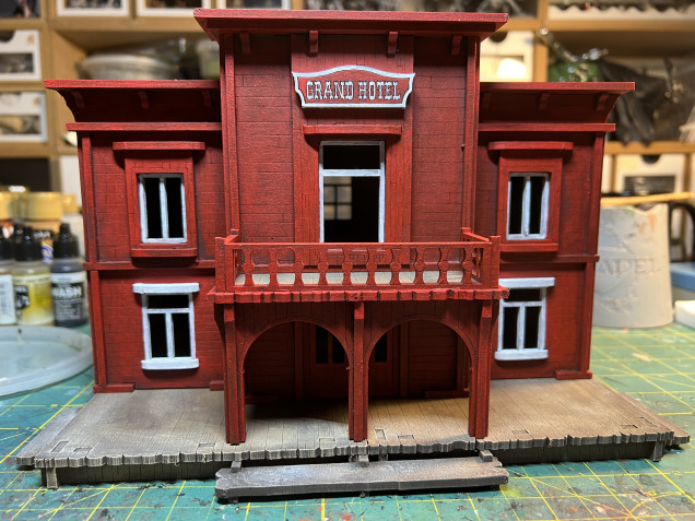 I painted the façade red and the rest of the building gets the usual weathered wood treatment (see one of the earlier posts).