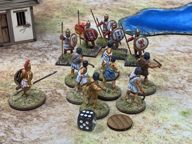 The Carthaginians charge and charge again and again and keep cutting down the slingers. But there are so many! And they cause a few casualties. They hold! Barely.   