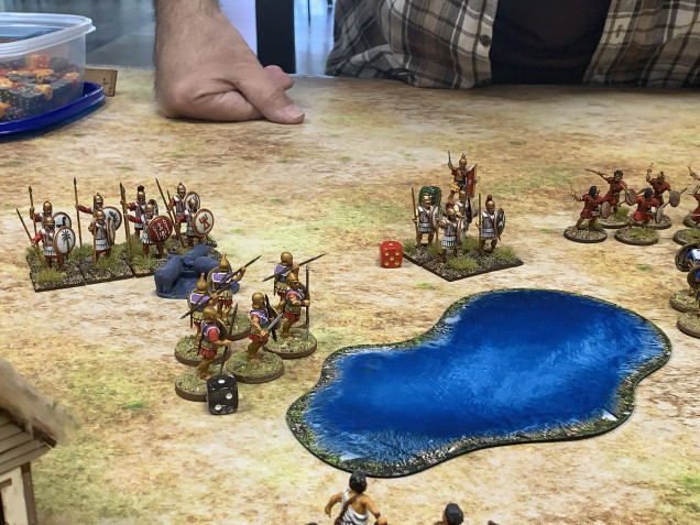 The Pezhetairoi and Hoplites both advance forcing the Carthaginian formation to redeploy with reduced numbers as they continue to take casualties from javelins and stones.
