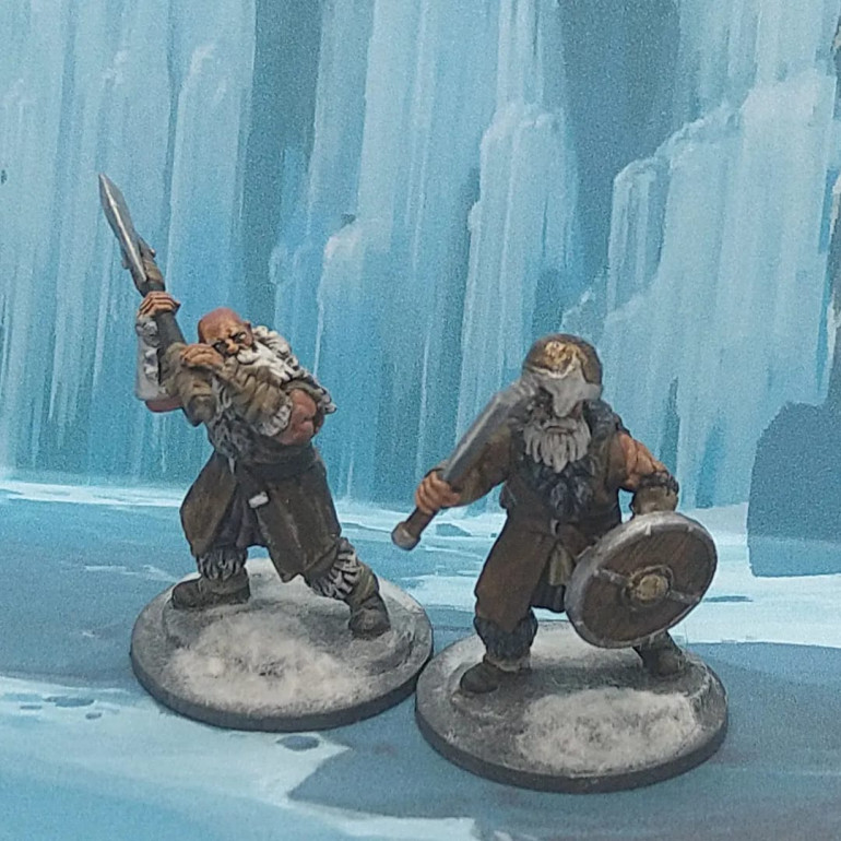 I found it fun and easy to play with the posing, grabbing a helmet I believe to be from the Frostgrave Soldiers box and putting it on a Barbarian bald head. It looked too big, but rather than remove it, I played to the fact that it was too big and have him trying to adjust the helmet with his axe.