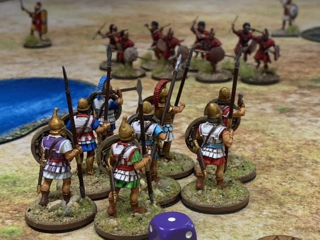 Seeing an opportunity for glory the Hoplites steadily advance up the middle losing a man to the Numidian javelins.